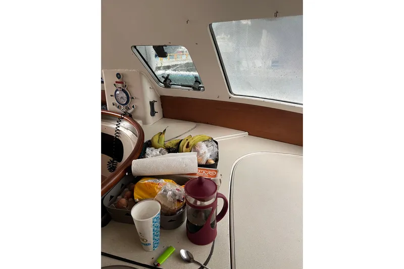 Nikita 1 Yacht Photos Pics Interior of 2004 Fountaine Pajot Bahia 46 with food items and kitchenware.