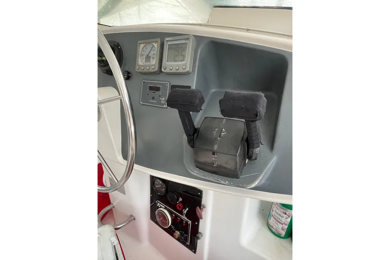 Nikita 1 Yacht Photos Pics Control panel of 2004 Fountaine Pajot Bahia 46 catamaran with gauges and throttle levers.