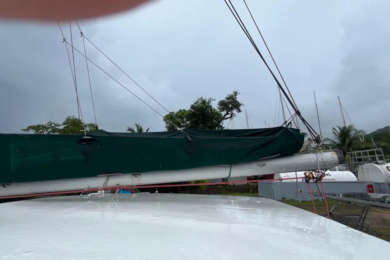 Nikita 1 Yacht Photos Pics 2004 Fountaine Pajot Bahia 46 catamaran with covered sail, docked in a marina.