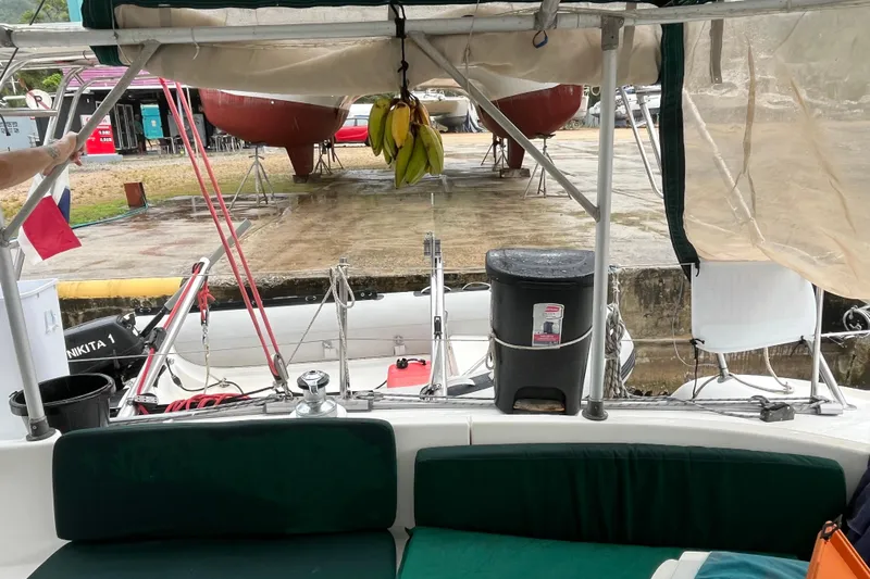 Nikita 1 Yacht Photos Pics 2004 Fountaine Pajot Bahia 46 catamaran interior with dock view and hanging bananas.