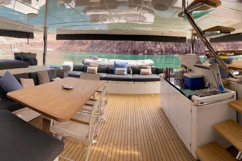Sona 1 Yacht Photos Pics Luxurious 2019 Lagoon 630 MY yacht interior with elegant seating and scenic water view.