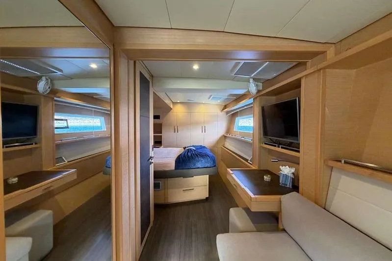 Sona 1 Yacht Photos Pics Luxurious interior of 2019 Lagoon 630 MY yacht with modern furnishings and cozy bedroom.