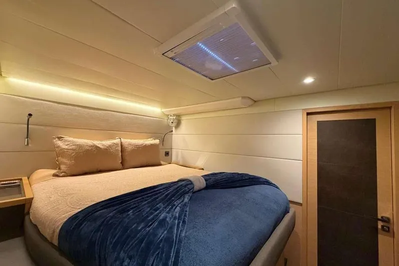 Sona 1 Yacht Photos Pics Luxurious bedroom interior of 2019 Lagoon 630 MY yacht with cozy bedding.