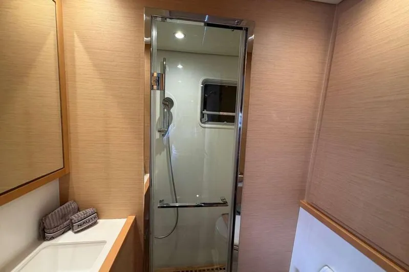 Sona 1 Yacht Photos Pics Luxurious bathroom interior of 2019 Lagoon 630 MY yacht with modern shower.