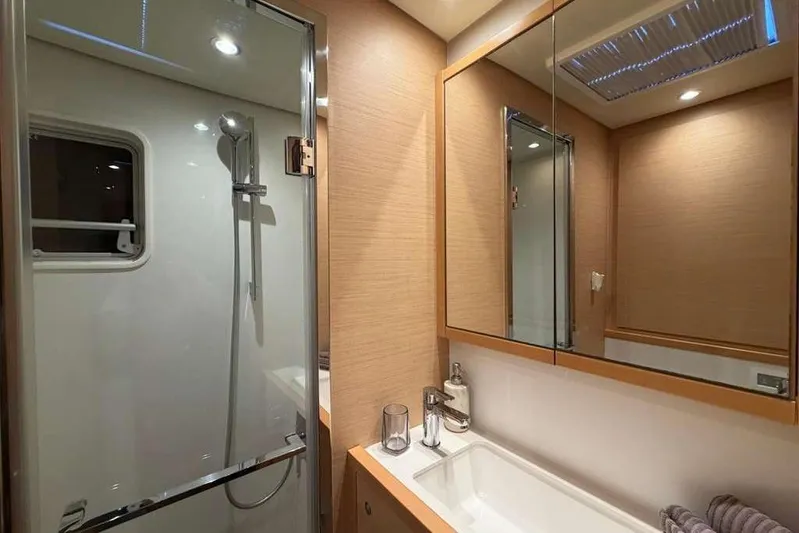 Sona 1 Yacht Photos Pics Luxurious bathroom in 2019 Lagoon 630 MY yacht with modern fixtures and elegant design.