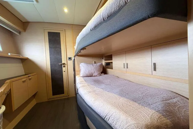 Sona 1 Yacht Photos Pics Luxurious cabin interior of 2019 Lagoon 630 MY yacht with bunk beds and modern design.