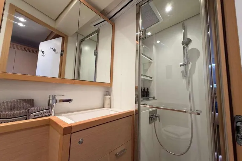 Sona 1 Yacht Photos Pics Luxurious bathroom interior of 2019 Lagoon 630 MY yacht with modern shower and vanity.