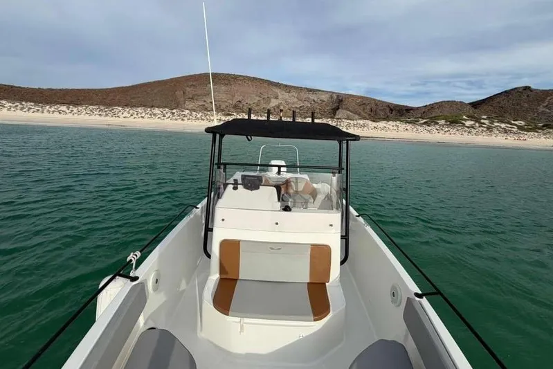 Sona 1 Yacht Photos Pics 2019 Lagoon 630 MY yacht on calm waters near a sandy beach.