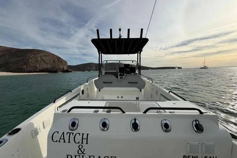 Sona 1 Yacht Photos Pics 2019 Lagoon 630 MY yacht on serene water with scenic coastal backdrop.