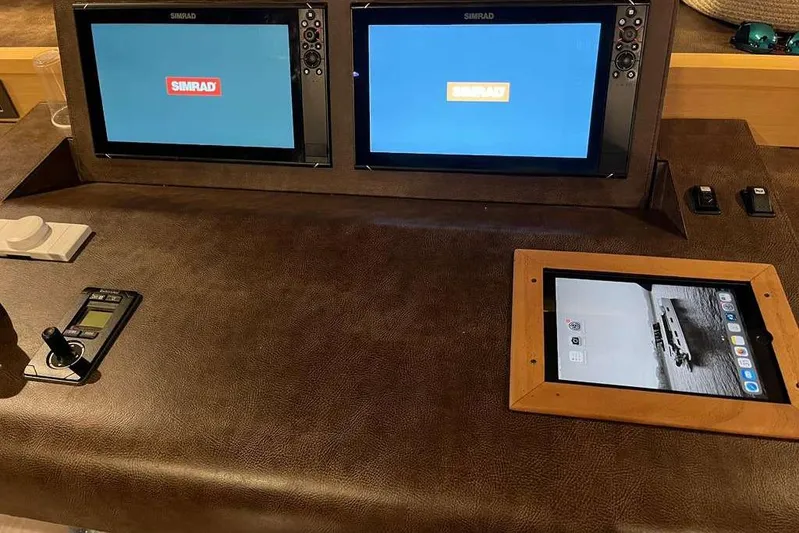 Sona 1 Yacht Photos Pics Control panel of 2019 Lagoon 630 MY yacht with Simrad displays and tablet.
