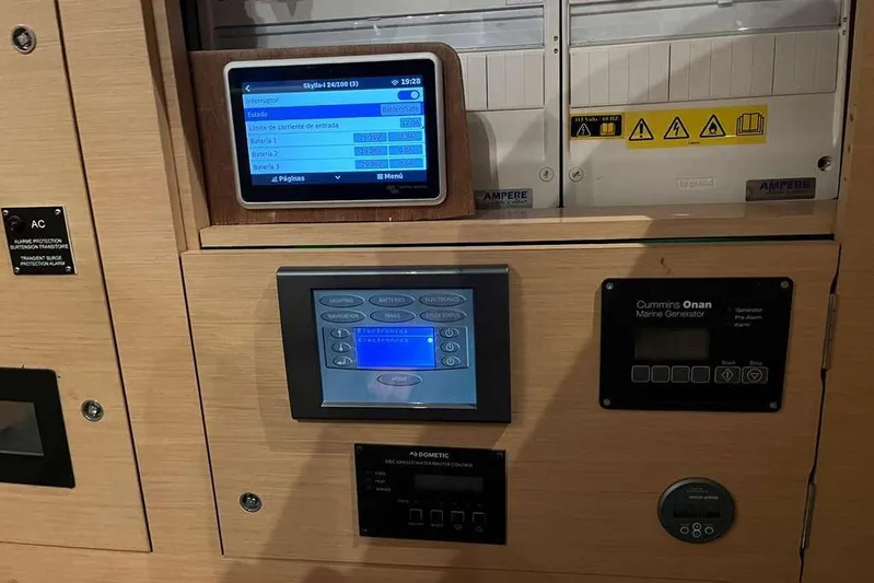 Sona 1 Yacht Photos Pics Control panel of a 2019 Lagoon 630 MY yacht, featuring electronic displays and generator controls.