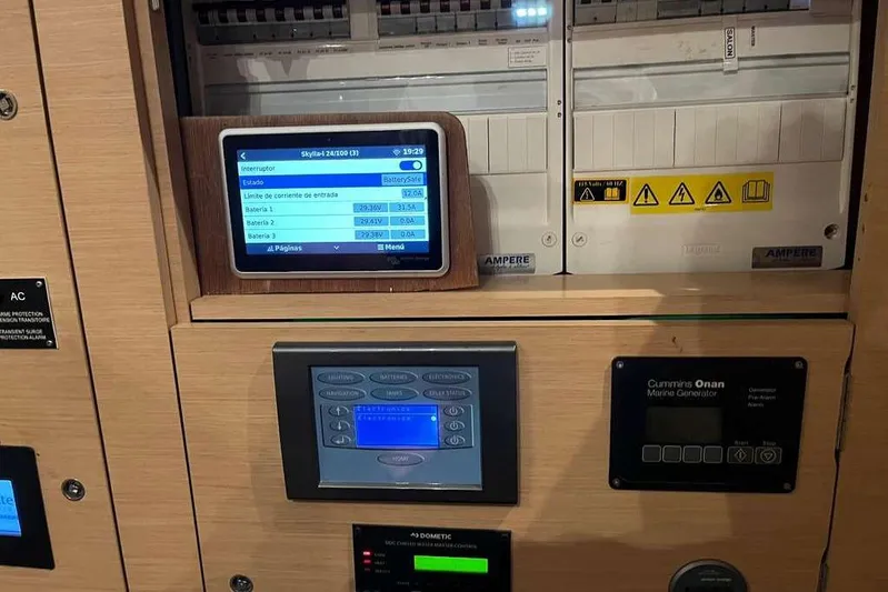 Sona 1 Yacht Photos Pics Control panel of a 2019 Lagoon 630 MY yacht with digital displays and warning labels.