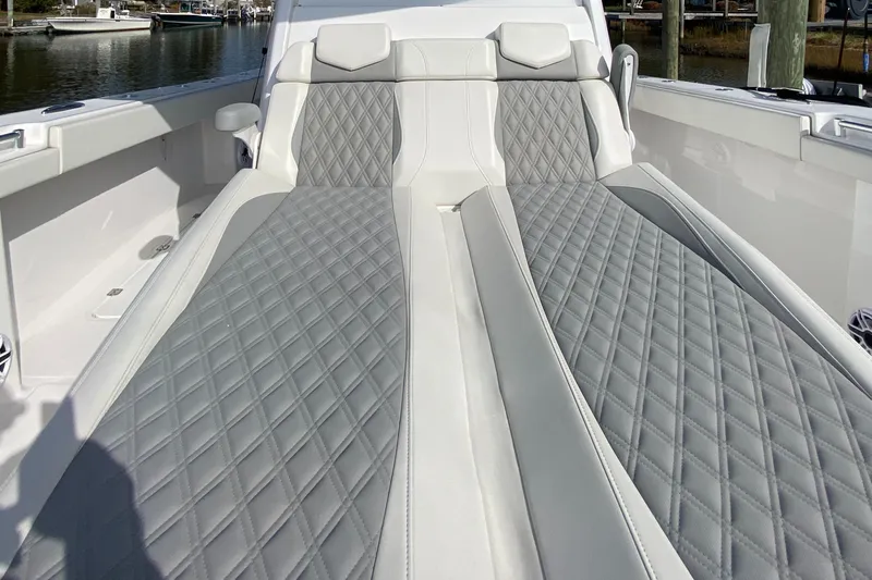  Yacht Photos Pics Luxurious seating on 2023 Invincible 46 Catamaran, featuring diamond-stitched upholstery.