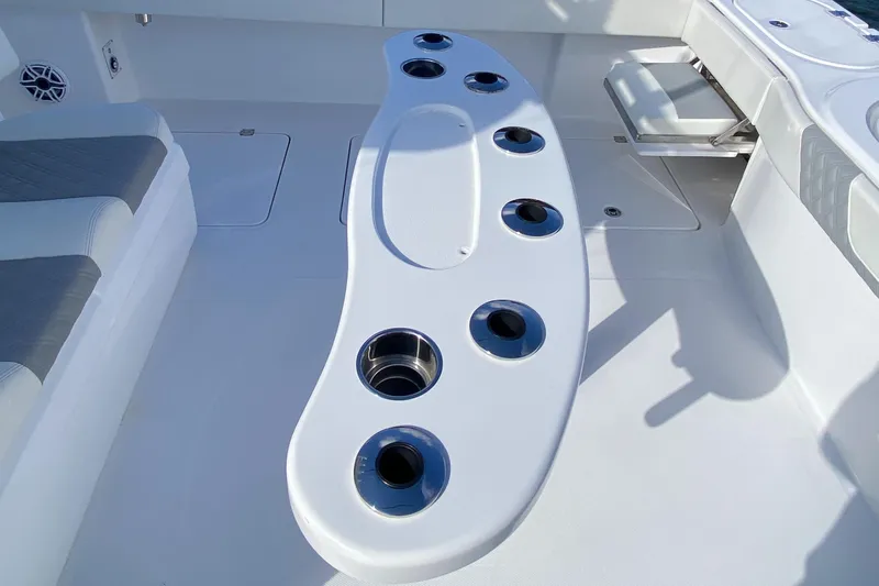  Yacht Photos Pics 2023 Invincible 46 Catamaran Plus Quad Axle Trailer, featuring a sleek deck with multiple cup holders.