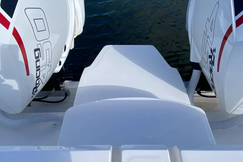  Yacht Photos Pics 2023 Invincible 46 Catamaran Plus with dual outboard engines on water.