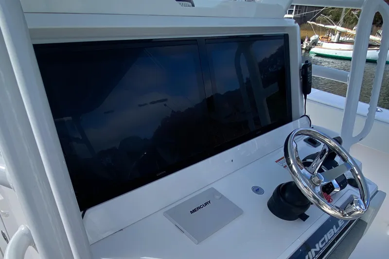  Yacht Photos Pics 2023 Invincible 46 Catamaran helm with steering wheel and electronic display.