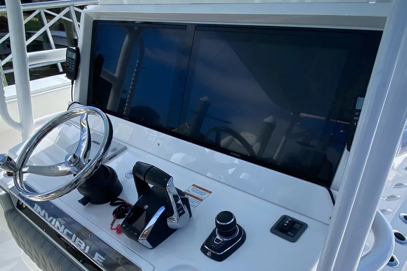  Yacht Photos Pics 2023 Invincible 46 Catamaran helm with dual screens and controls.