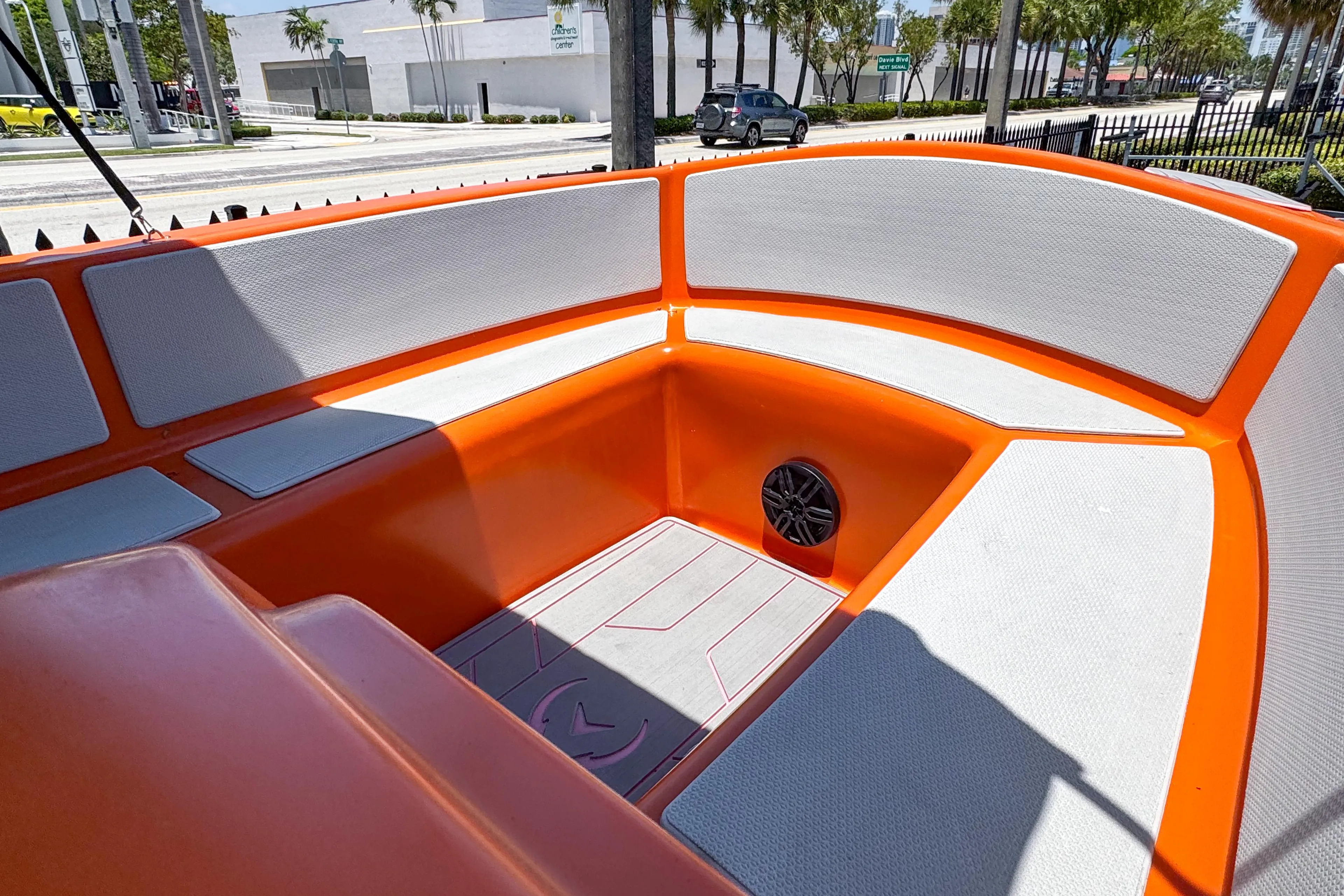 2024 Vision Marine Technologies Phantom boat interior with orange and gray seating.