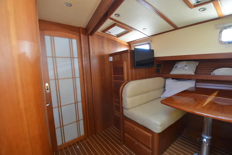 Sea Pilot Yacht Photos Pics 2014 Sabre 42 Salon Express interior with wood finish, seating, and table.