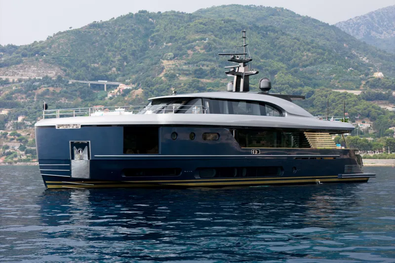 Palmax Yacht Photos Pics Azimut Magellano 30M 2022 yacht on serene water with lush hills in the background.