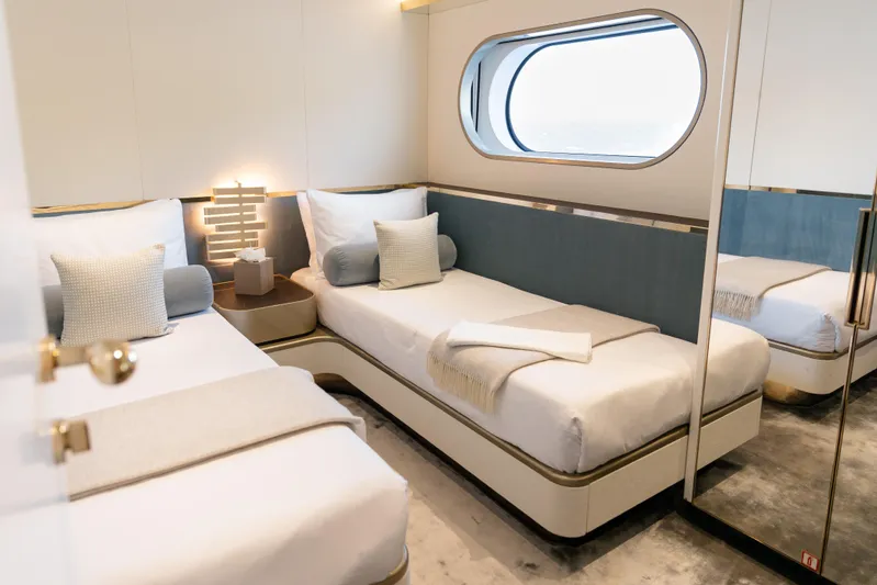 Palmax Yacht Photos Pics Luxurious twin bedroom on 2022 Azimut Magellano 30M yacht with modern decor and ocean view.