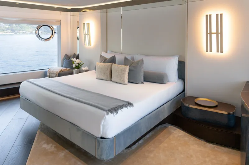 Palmax Yacht Photos Pics Luxurious Master bedroom interior on 2022 Azimut Magellano 30M yacht with ocean view.