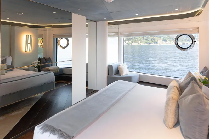 Palmax Yacht Photos Pics Luxurious bedroom interior on 2022 Azimut Magellano 30M yacht with scenic ocean view.