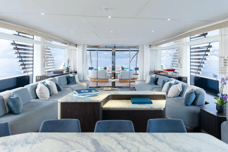 Palmax Yacht Photos Pics Luxurious interior of 2022 Azimut Magellano 30M yacht with elegant seating and panoramic windows.