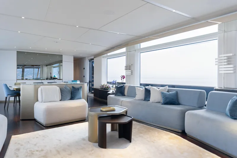 Palmax Yacht Photos Pics Luxurious interior of 2022 Azimut Magellano 30M yacht with modern seating and large windows.
