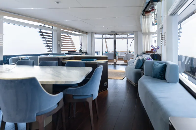 Palmax Yacht Photos Pics Luxurious interior of 2022 Azimut Magellano 30M yacht with elegant seating and dining area.