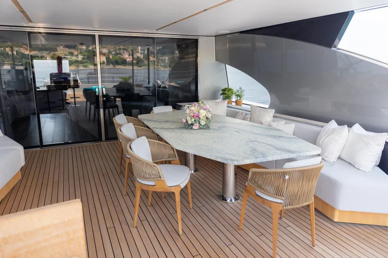 Palmax Yacht Photos Pics Luxurious Azimut Magellano 30M yacht deck with elegant dining area, 2022 model.