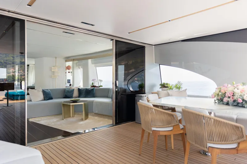 Palmax Yacht Photos Pics Luxurious interior of 2022 Azimut Magellano 30M yacht with elegant seating and dining area.