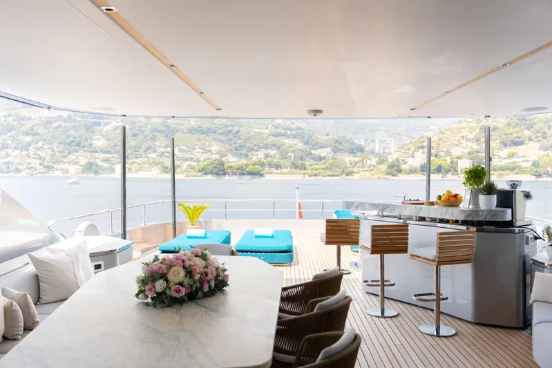 Palmax Yacht Photos Pics Luxurious Azimut Magellano 30M yacht interior with elegant seating, bar, and scenic ocean view.