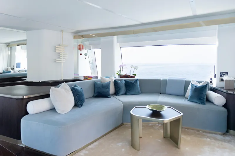 Palmax Yacht Photos Pics Luxurious interior of 2022 Azimut Magellano 30M yacht with elegant seating and ocean view.