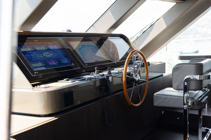 Palmax Yacht Photos Pics Luxurious helm of 2022 Azimut Magellano 30M yacht with advanced navigation displays.