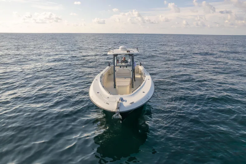  Yacht Photos Pics 2022 Hydra-Sports 3400 boat on open ocean under cloudy sky.