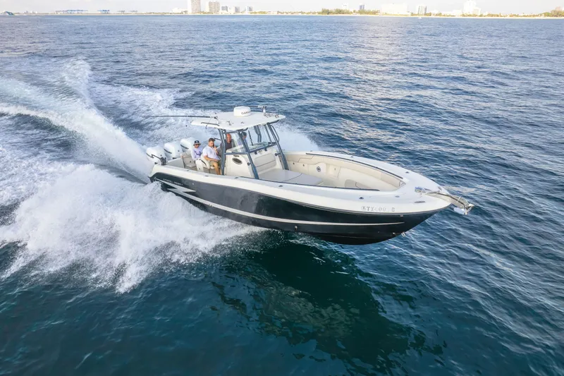  Yacht Photos Pics 2022 Hydra-Sports 3400 boat cruising on open water, showcasing sleek design and performance.