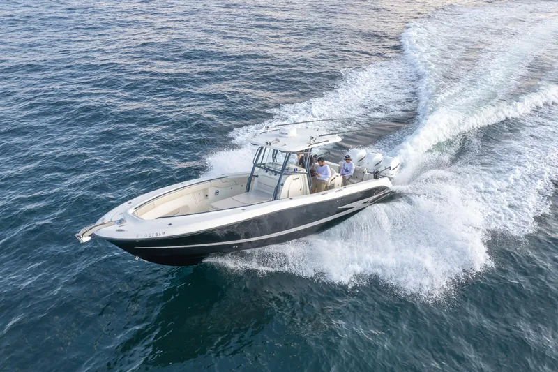  Yacht Photos Pics 2022 Hydra-Sports 3400 boat cruising on open water, creating a dynamic wake.