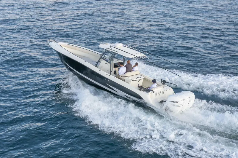  Yacht Photos Pics 2022 Hydra-Sports 3400 boat cruising on open water with passengers onboard.