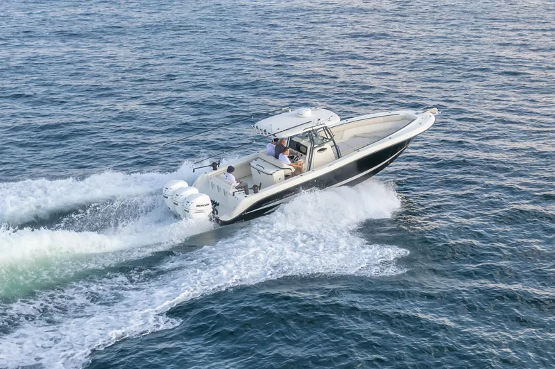  Yacht Photos Pics 2022 Hydra-Sports 3400 boat cruising on open water, creating a wake.