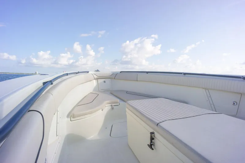  Yacht Photos Pics 2022 Hydra-Sports 3400 boat interior with seating and storage, under a clear blue sky.