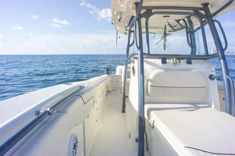  Yacht Photos Pics 2022 Hydra-Sports 3400 boat on open sea, clear sky, and calm waters.