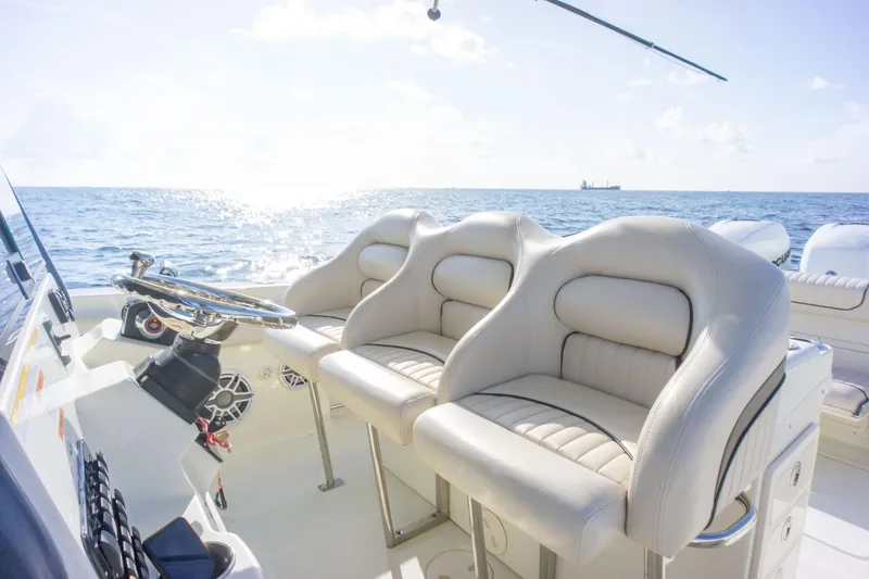 Yacht Photos Pics 2022 Hydra-Sports 3400 boat interior with plush seating, ocean view in background.
