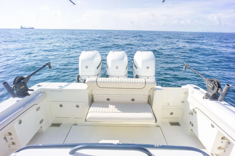  Yacht Photos Pics 2022 Hydra-Sports 3400 boat with triple engines on open sea.