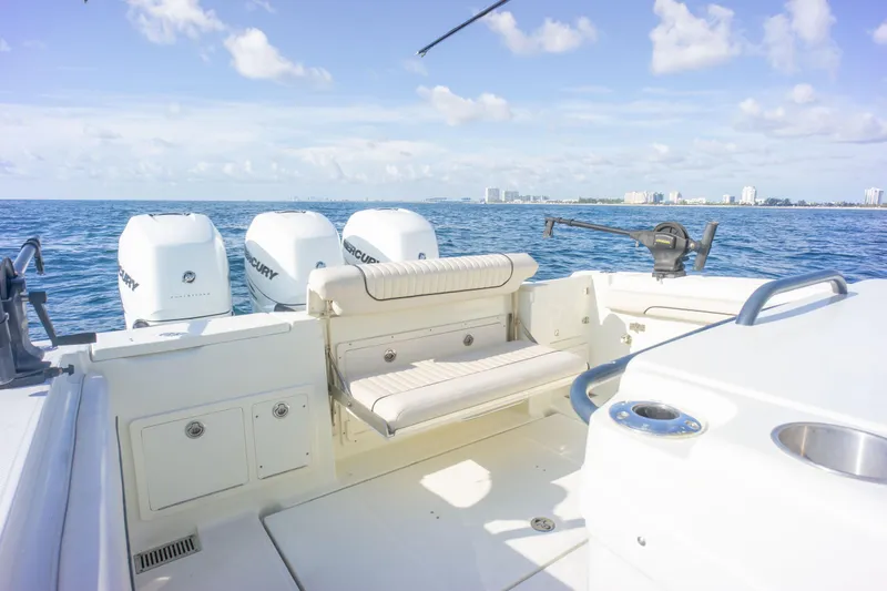  Yacht Photos Pics 2022 Hydra-Sports 3400 boat with triple Mercury engines on open sea.