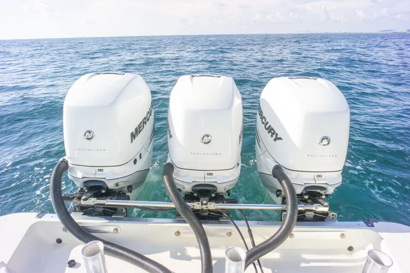  Yacht Photos Pics Triple Mercury outboard engines on 2022 Hydra-Sports 3400 boat in open sea.