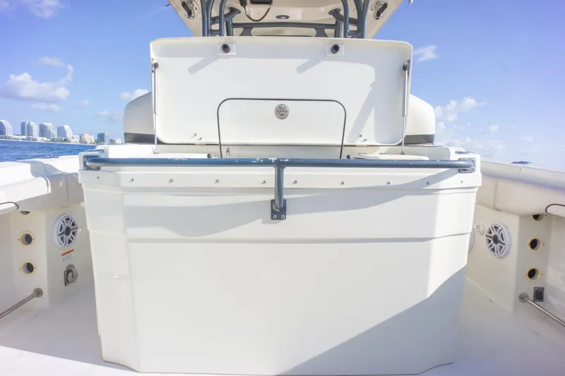  Yacht Photos Pics 2022 Hydra-Sports 3400 boat interior with seating and storage, under clear blue sky.