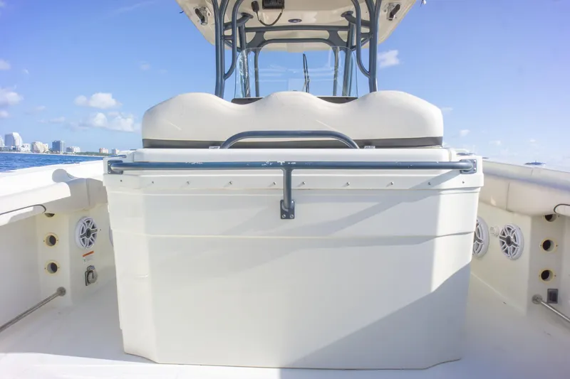  Yacht Photos Pics 2022 Hydra-Sports 3400 boat interior with seating and storage, under clear blue sky.