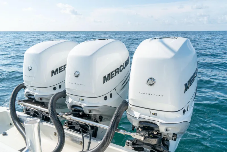  Yacht Photos Pics Triple Mercury outboard engines on a 2022 Hydra-Sports 3400 boat in open water.