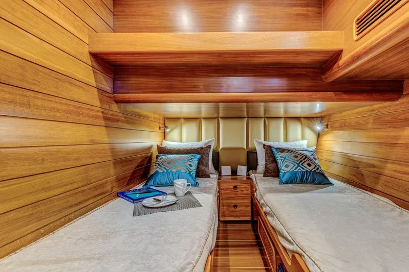  Yacht Photos Pics Luxurious twin cabin in 2025 Norseman 45 FreeOcean yacht, featuring elegant wood paneling.